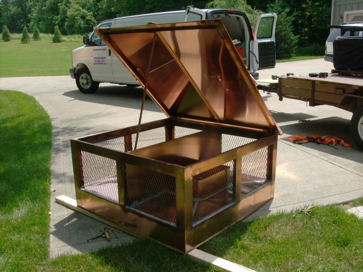 Custom copper chimney cap (or shroud) with hinged access.