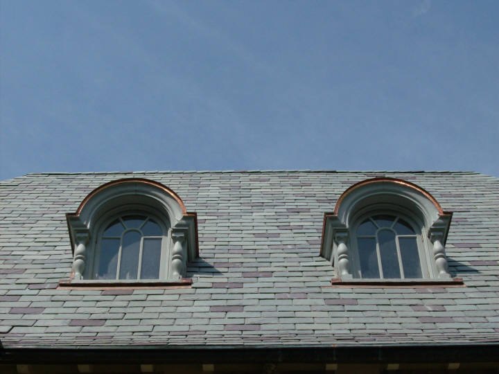 Copper barrel dormer flat seam roofs - ground view.